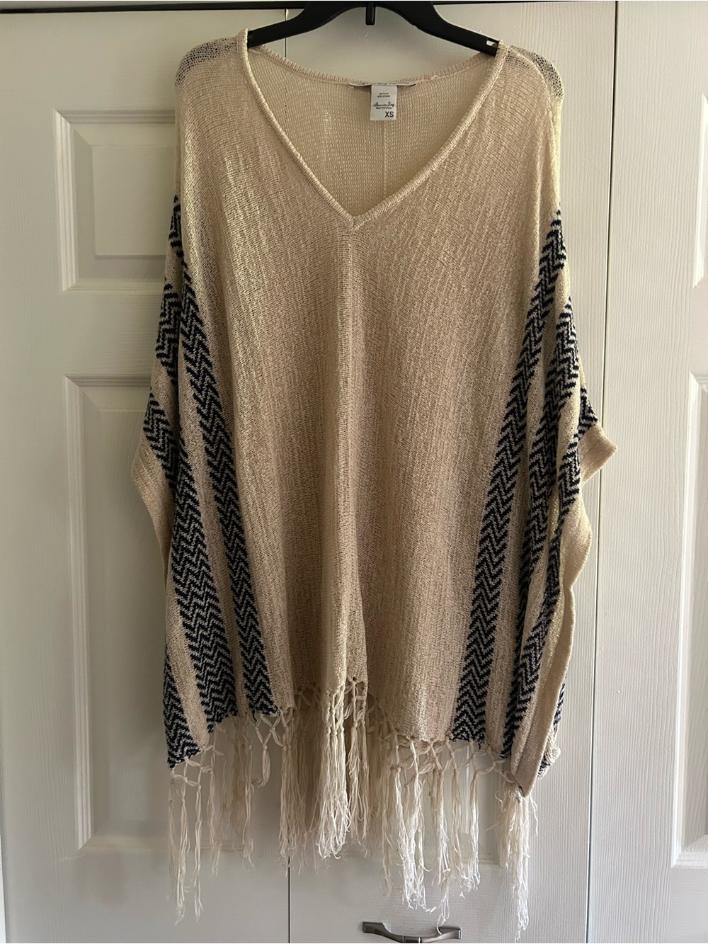 American Rag Cream Knit Fringe V-Neck Poncho with Black Chevron Panels